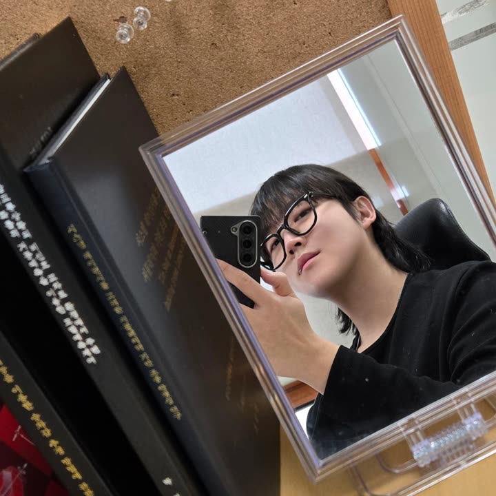 Ujin — mirror selfie, black knit, glasses